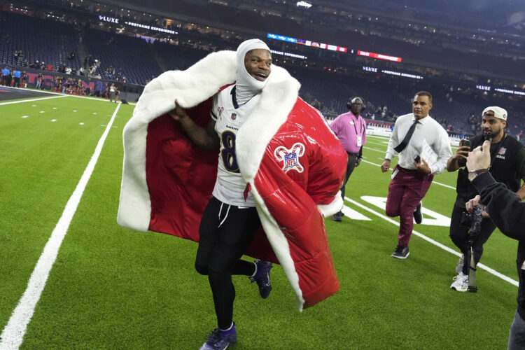 Jackson breaks Vick's NFL rushing record for QBs in Ravens' rout over Texans